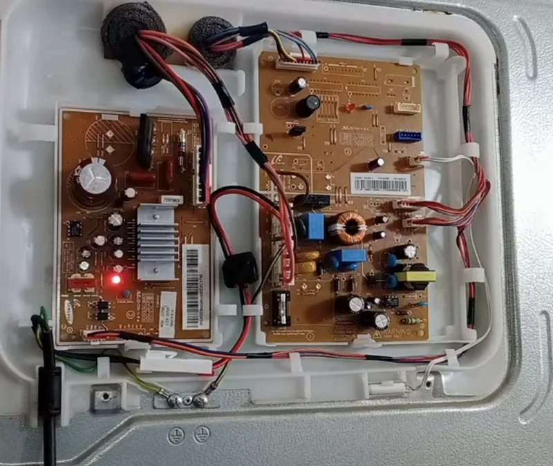 Appliance electronic control board inspected for surge damage during a Spartanburg repair