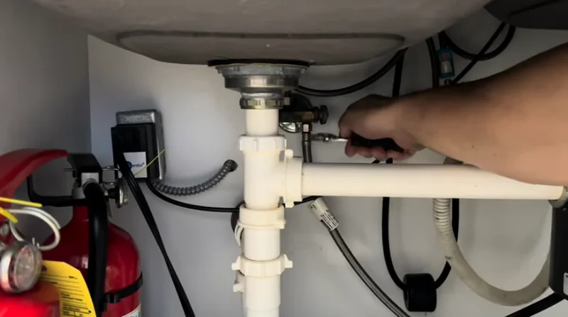 Under-sink drain and garbage disposal connection checked on a Spartanburg service call