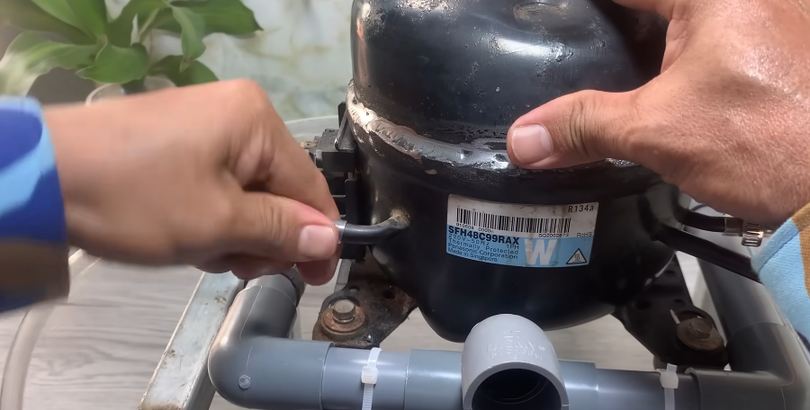 Freezer compressor inspected during an in-home appliance repair in Spartanburg SC