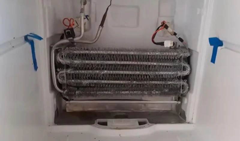 Evaporator coils inside a freezer compartment inspected during a defrost system repair in Spartanburg SC