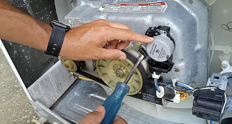 Technician diagnosing a washing machine component during a same-day appliance repair in Spartanburg SC